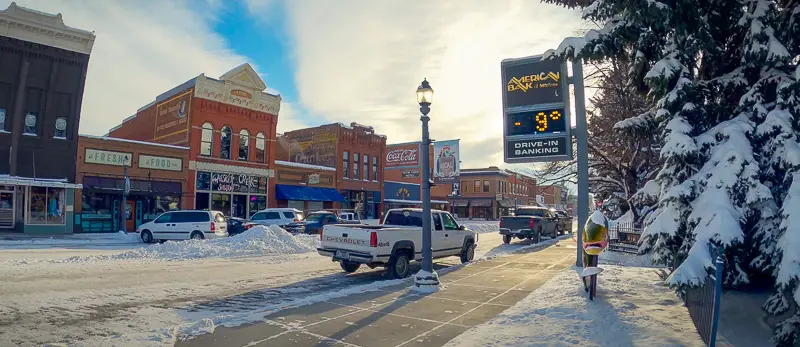 Main street shops, bank thermometer, and painted fish on our citywalks live