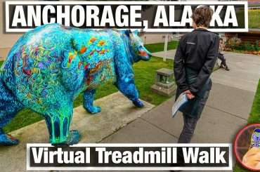 boy walks past colorful bear sculpture in Anchorage, Alaska