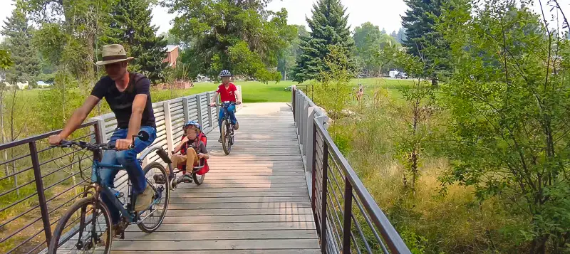 People on Bikes on bridge to Burk Park during our citywalks