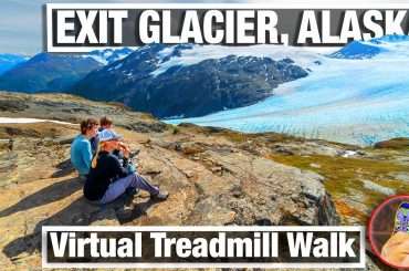 Family looking out over Exit Glacier in Kenai Fjords National Park in Alaska on nature walk