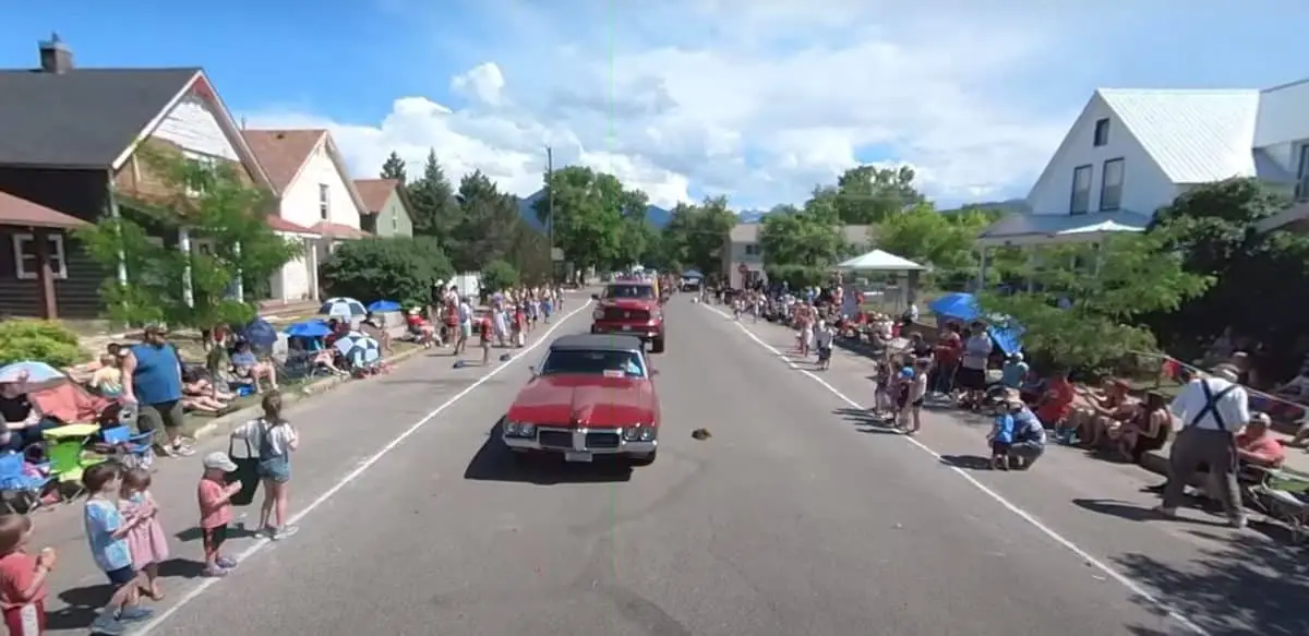 view of parade floats from mule in Livingston Roundup