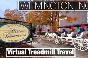 Horse drawn carriage near Historic Wilmington, NC sign in downtown walking tour