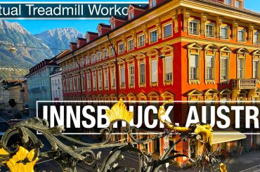 Sun shining on golden building and alps in Innsbruck Austria walking tour