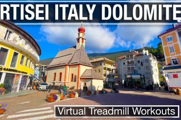 Church in center of Ortisei Italy on a sunny fall day seen during our virtual treadmill walk