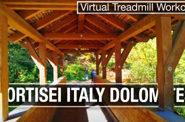 Covered bridge leading out of Ortisei, Italy up the nature hiking trail