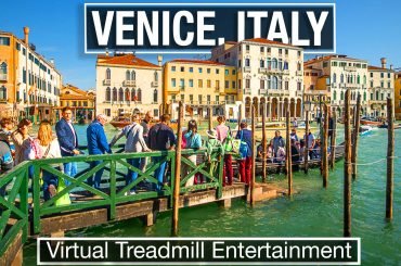 people wait at A traghetto stop on the Grand Canal of Venice