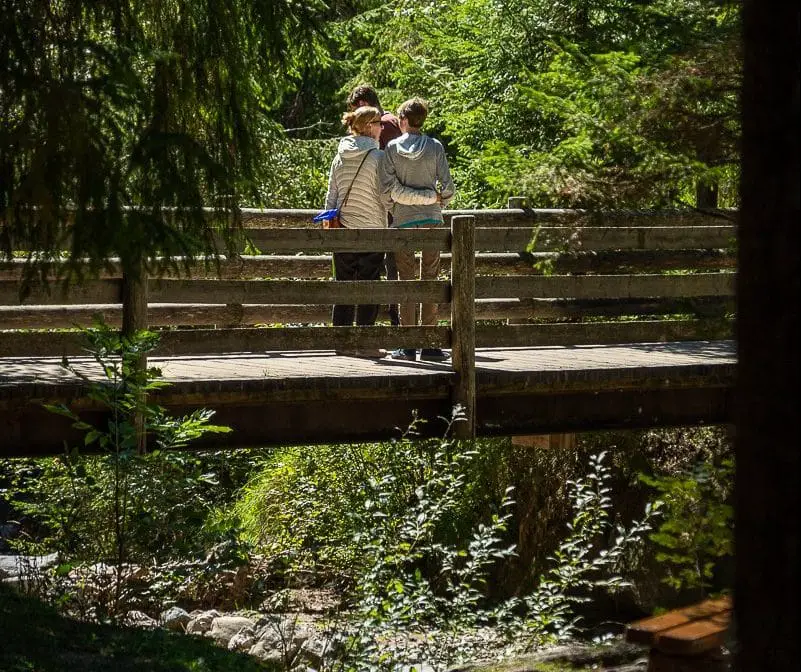 family on bridge in Ortisei, Italy