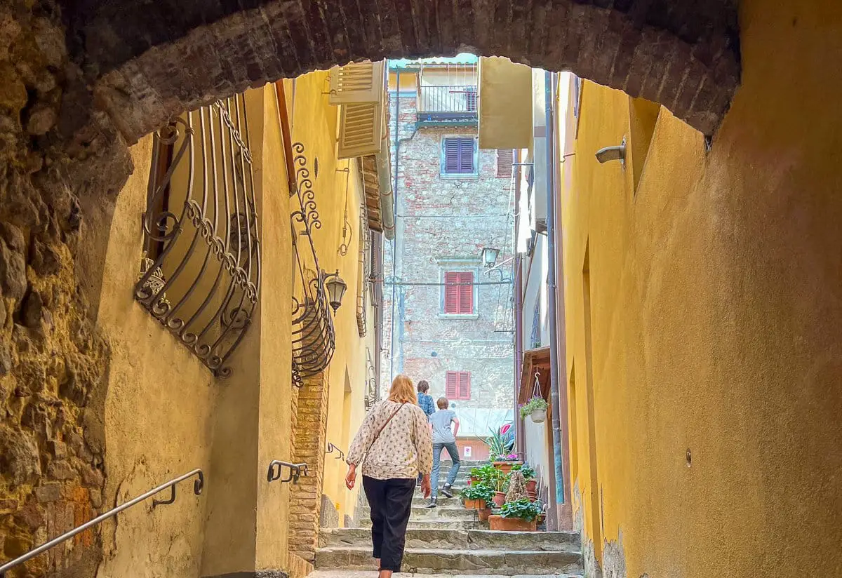 Walking up the narrow stairs found in Montepulciano, Italy on our City Walk