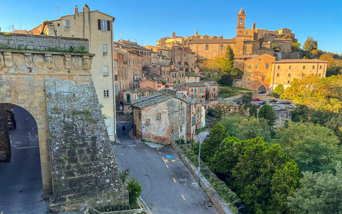 Porta Al Prato gate with Montepulciano in the morning sun