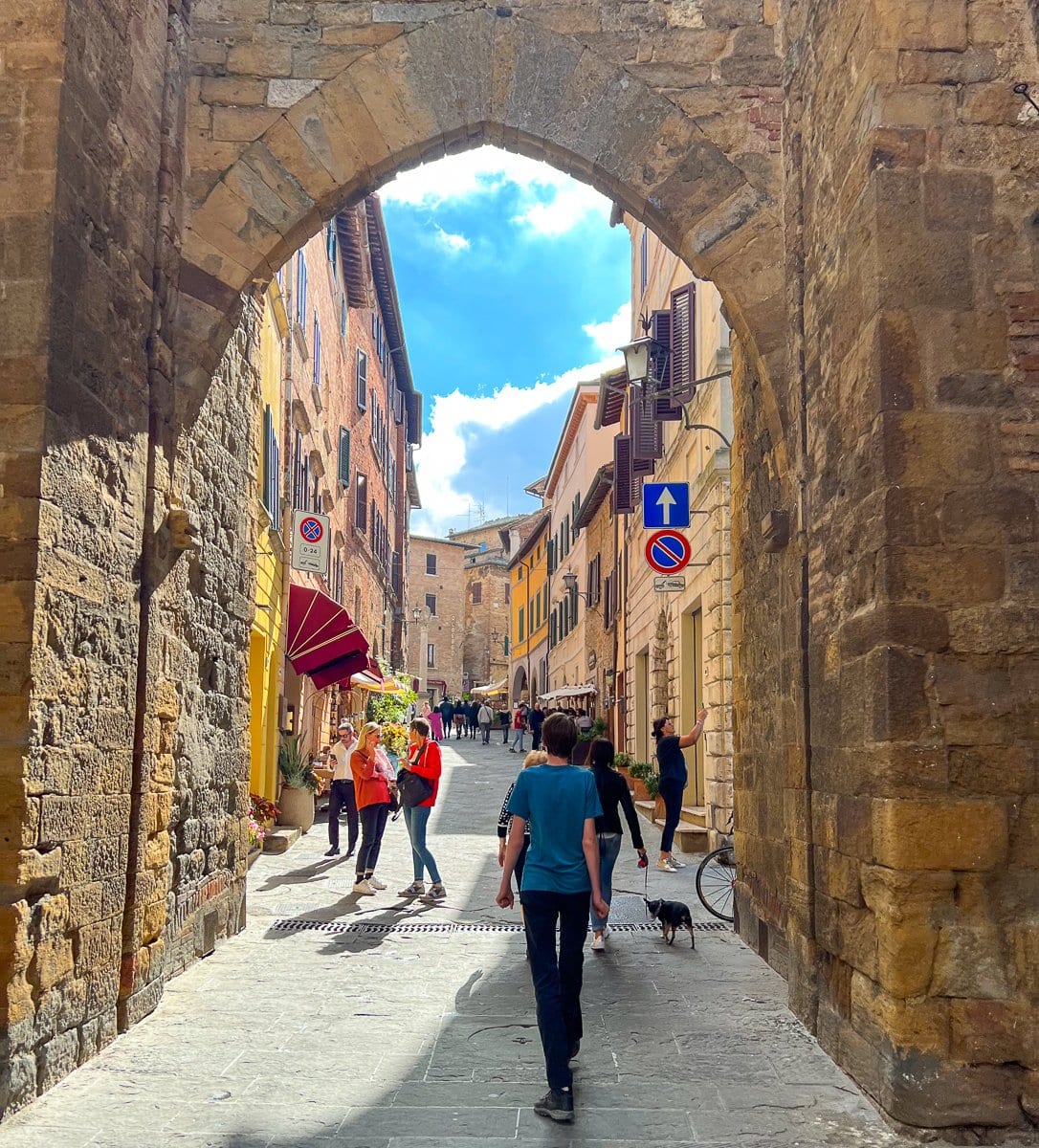 Tourists walk the streets of Montepulciano