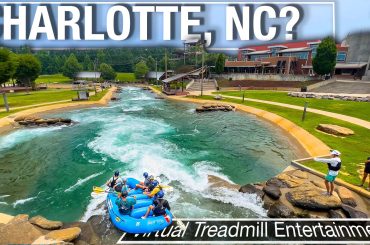 looking down at a raft going through a big rapid at the US National White Water Center