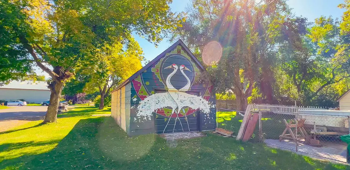 Cranes painted on shed in Bozeman