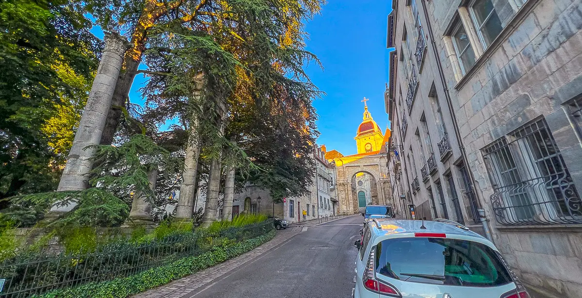 Roman Arch and Cathedral dome in golden light in Besanon at beginning of our virtual city walks live tour